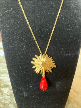 Gold Sunburst Pendant Necklace with a Dangling Teardrop Accent